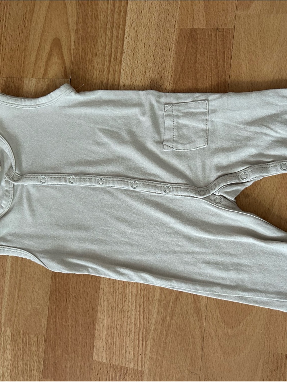 Kyte BABY Ivory Sleeveless Snap Romper